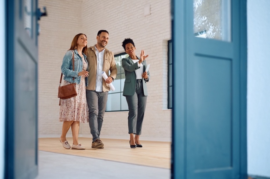 Real estate agent showing a home to a couple